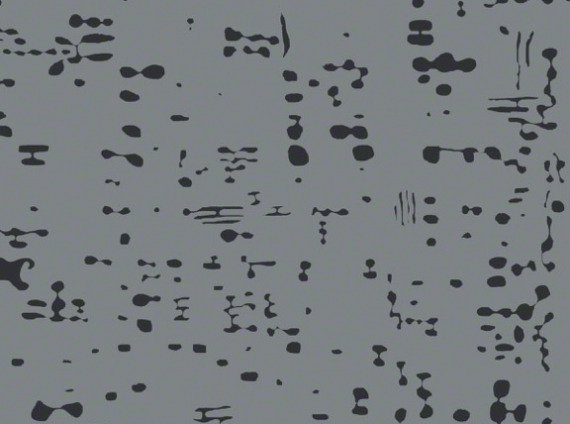 A gray and black speckled rug from ARZU